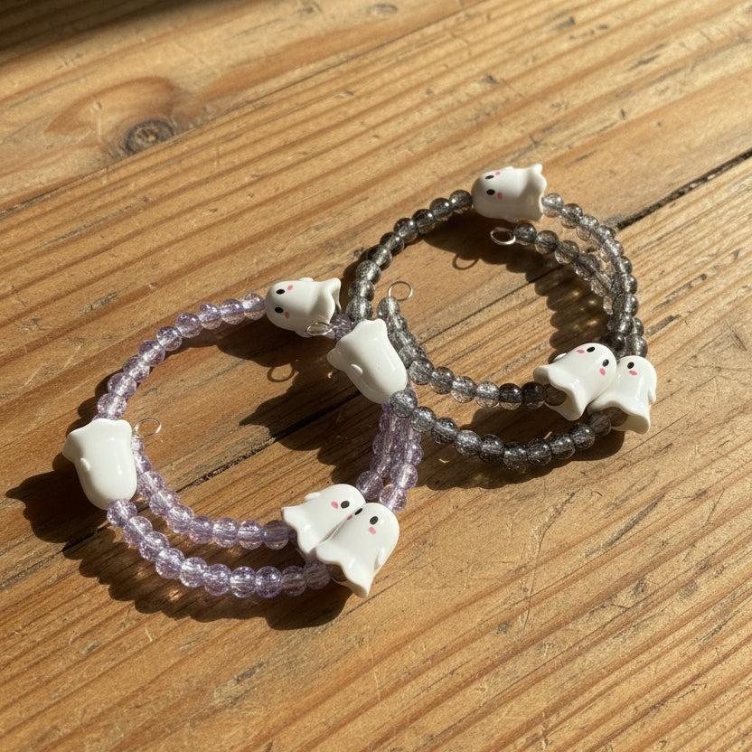 Two beaded stretch bracelets with white ghost charms 