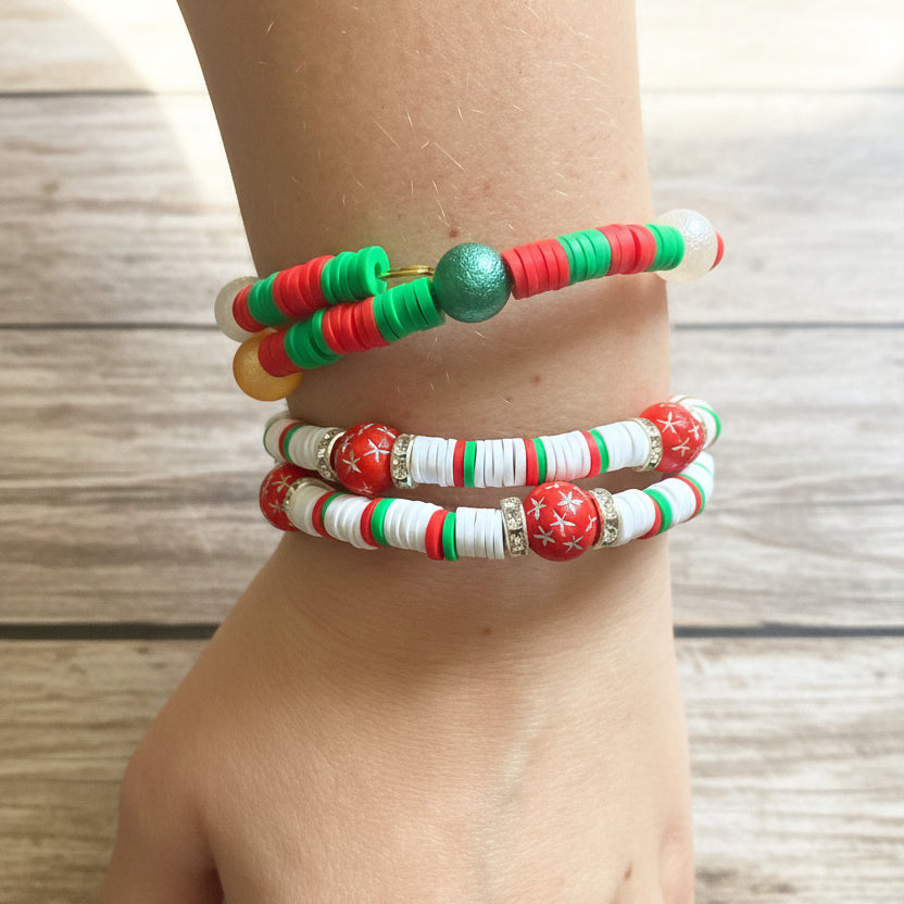 A close-up of a person's wrist wearing two beaded bracelets. 