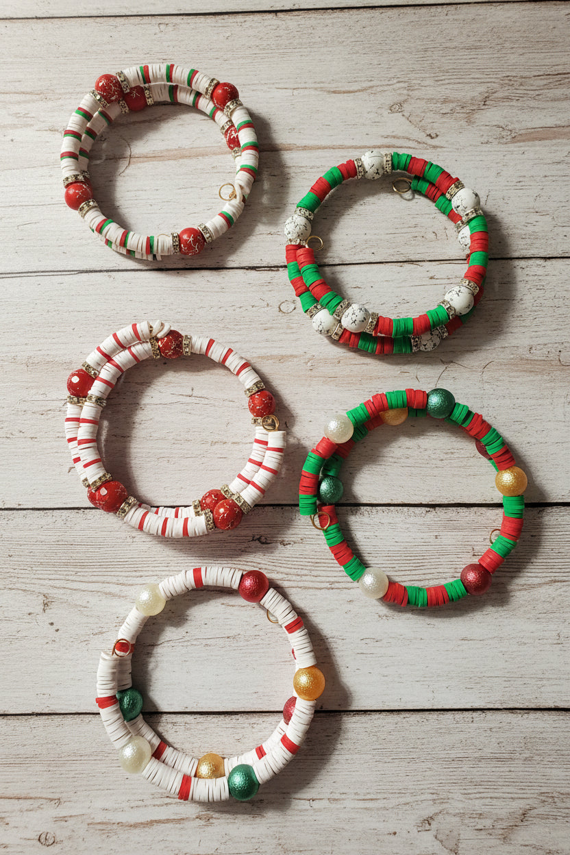 Five handmade beaded bracelets  The bracelets feature red, green, white, and some gold-toned beads, 