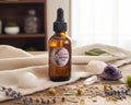 An amber glass dropper bottle labeled 'Full Moon Oil'